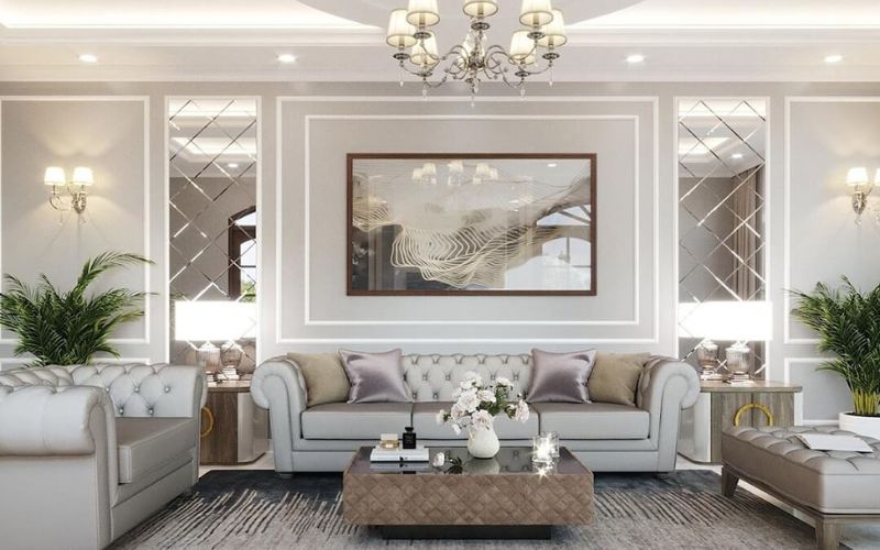 Thiết kế phòng tiếp khách tân cổ điển với sofa Chesterfield và bàn trà đá marble, tạo không gian tiếp đón sang trọng và riêng tư